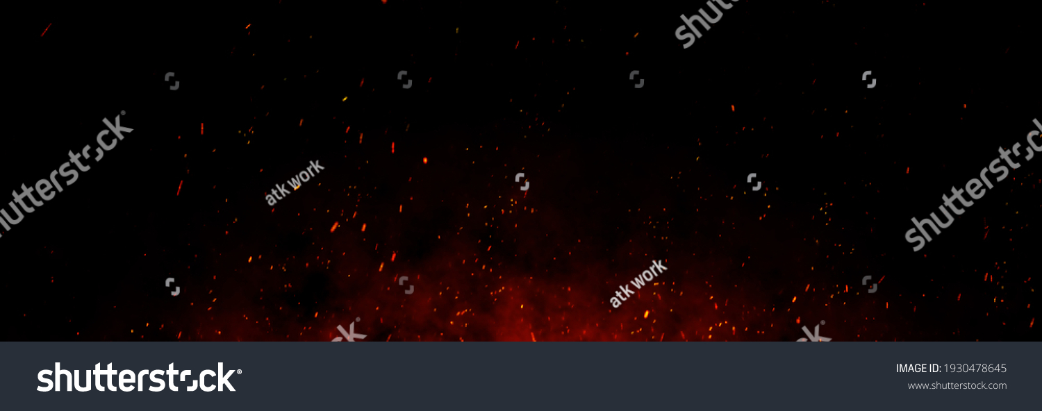 Feuerfunken und Glutpartikel auf schwarzem Hintergrund